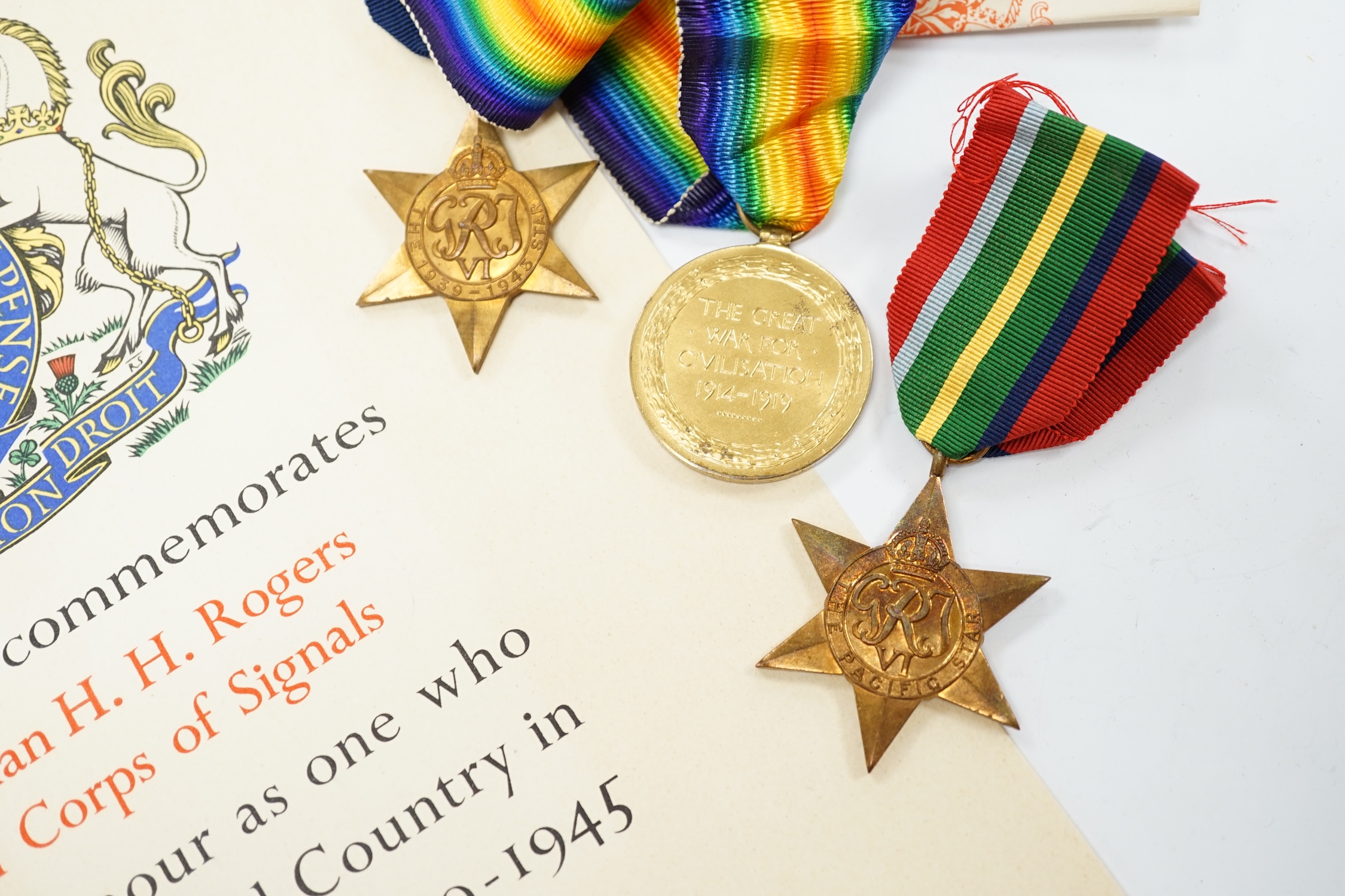 A WWII medal group awarded to Signalman H.H. Rogers, Royal Corps of Signals, comprising; a Pacific Star, a 1939-1945 Star, a Defence Medal and a 1939-1945 War Medal, together with the related note detailing the awards is